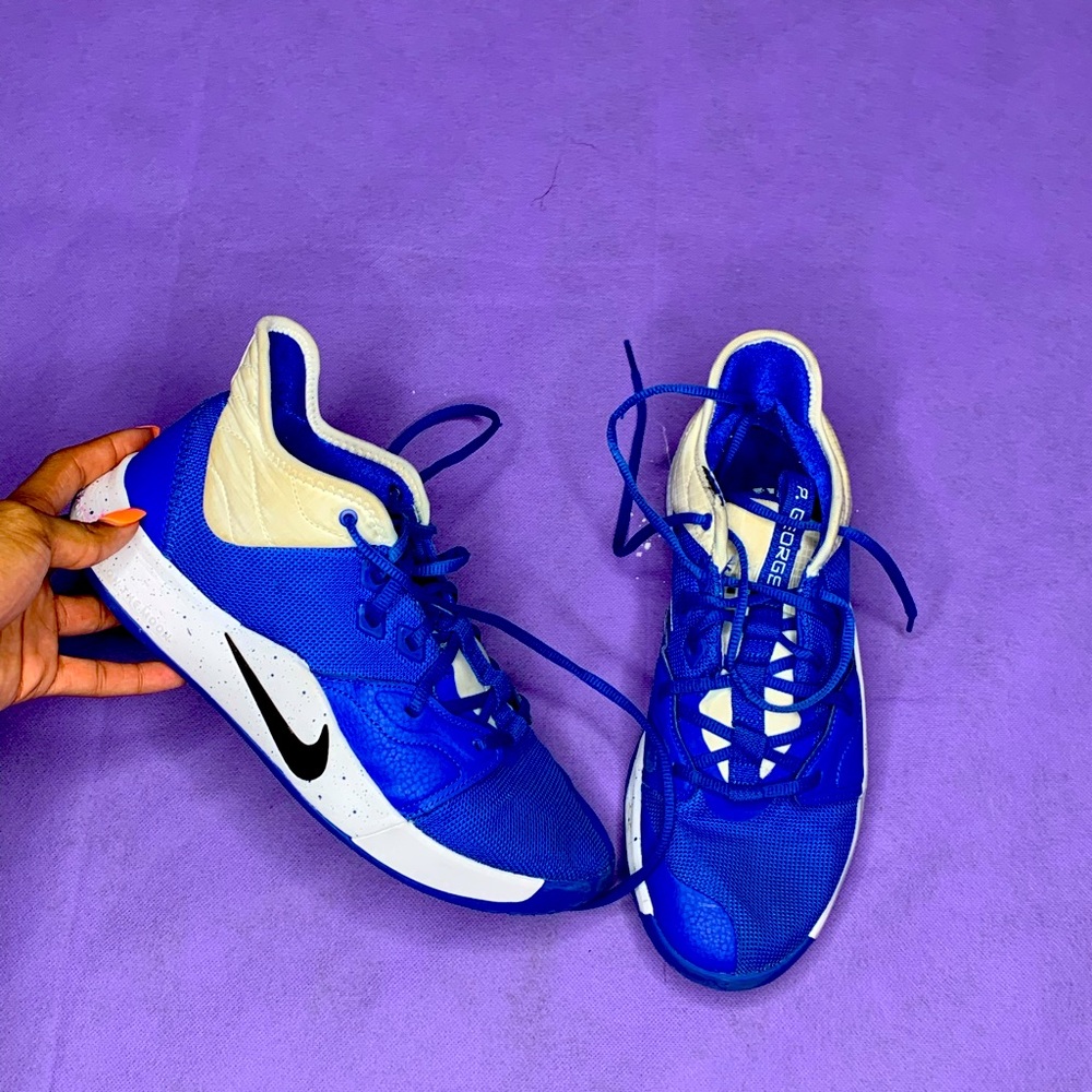 Blue and white Paul George basketball sneakers